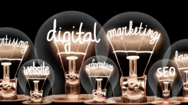 Light bulbs with words: advertising, analysis, website, digital, marketing, performance, SEO, brand, strategy.