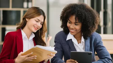 two professionals looking at documents