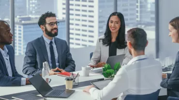 working professionals talking in a meeting