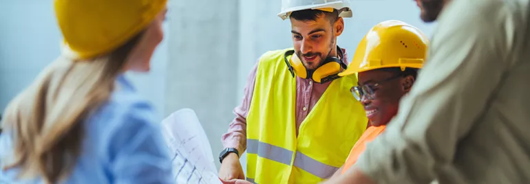 Construction workers looking at a construction map