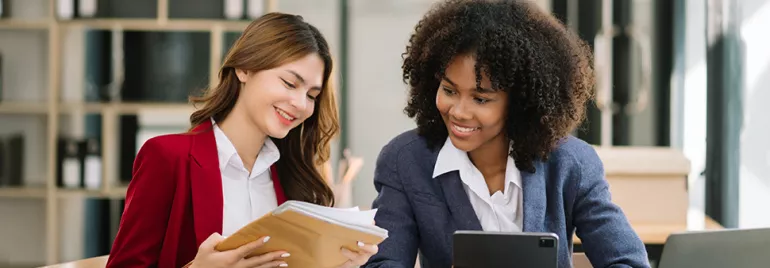 two professionals looking at documents